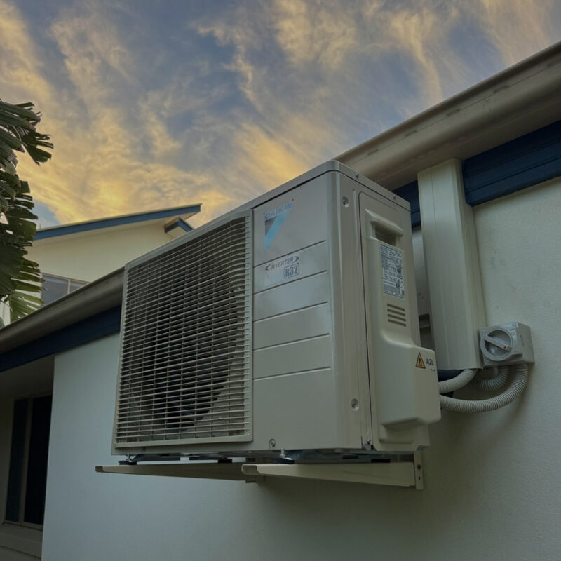 Daikin outdoor condenser unit mounted on a wall bracket
